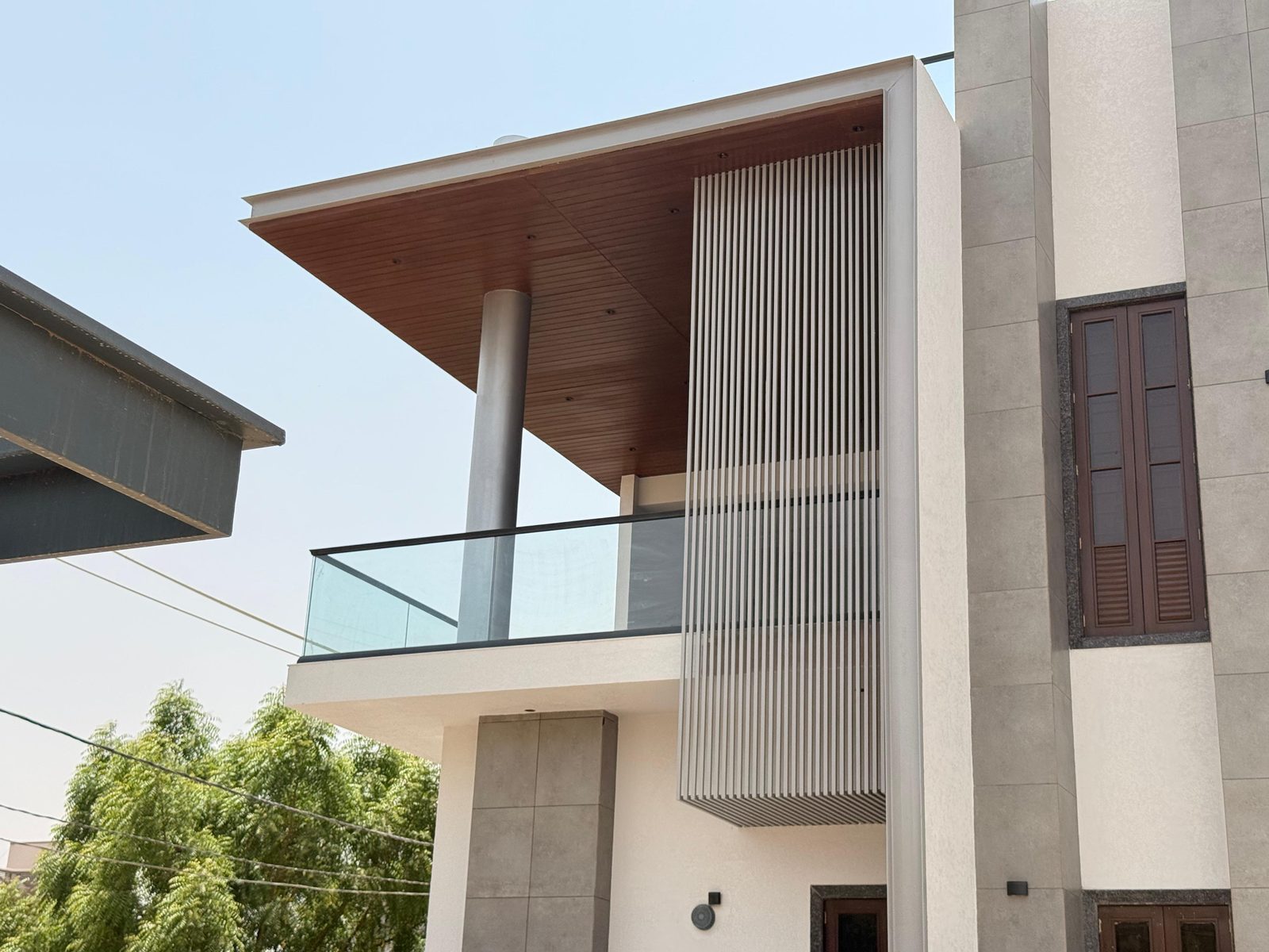 Grey painted Woodium battens on a facade