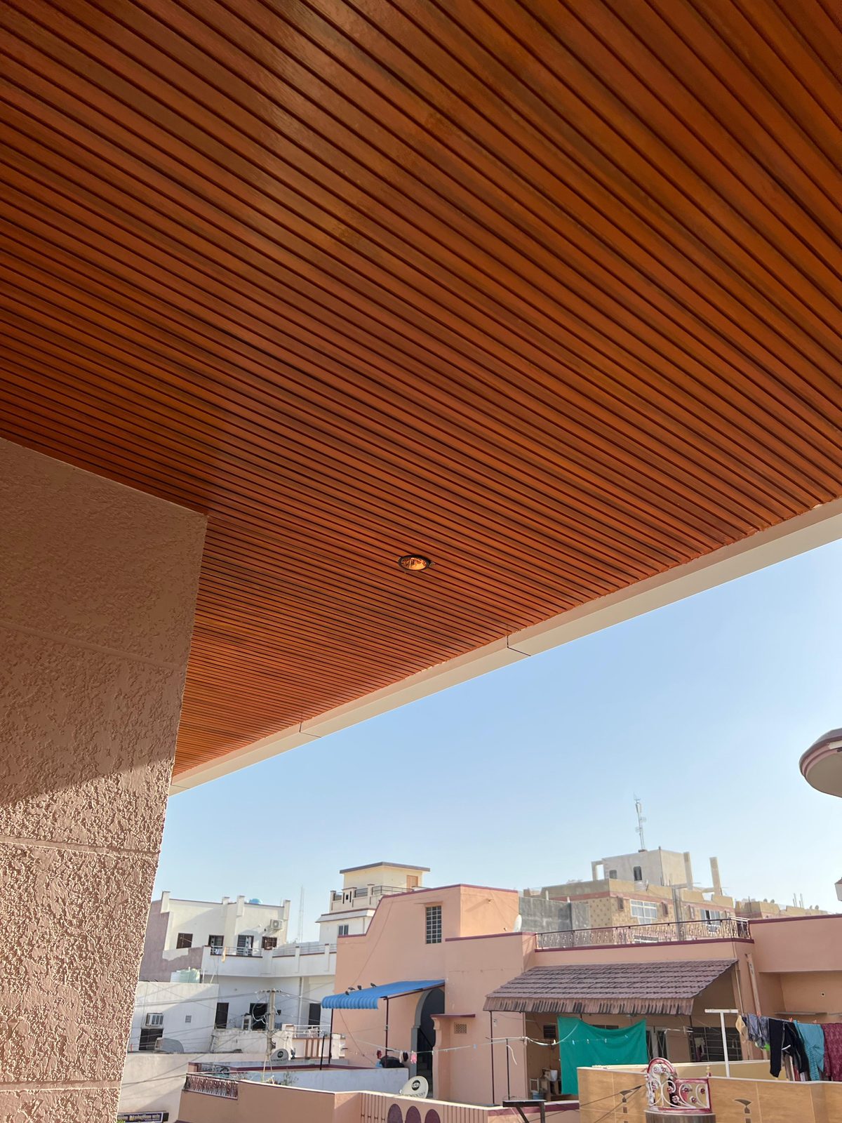 Wood-tone Woodium balcony ceiling