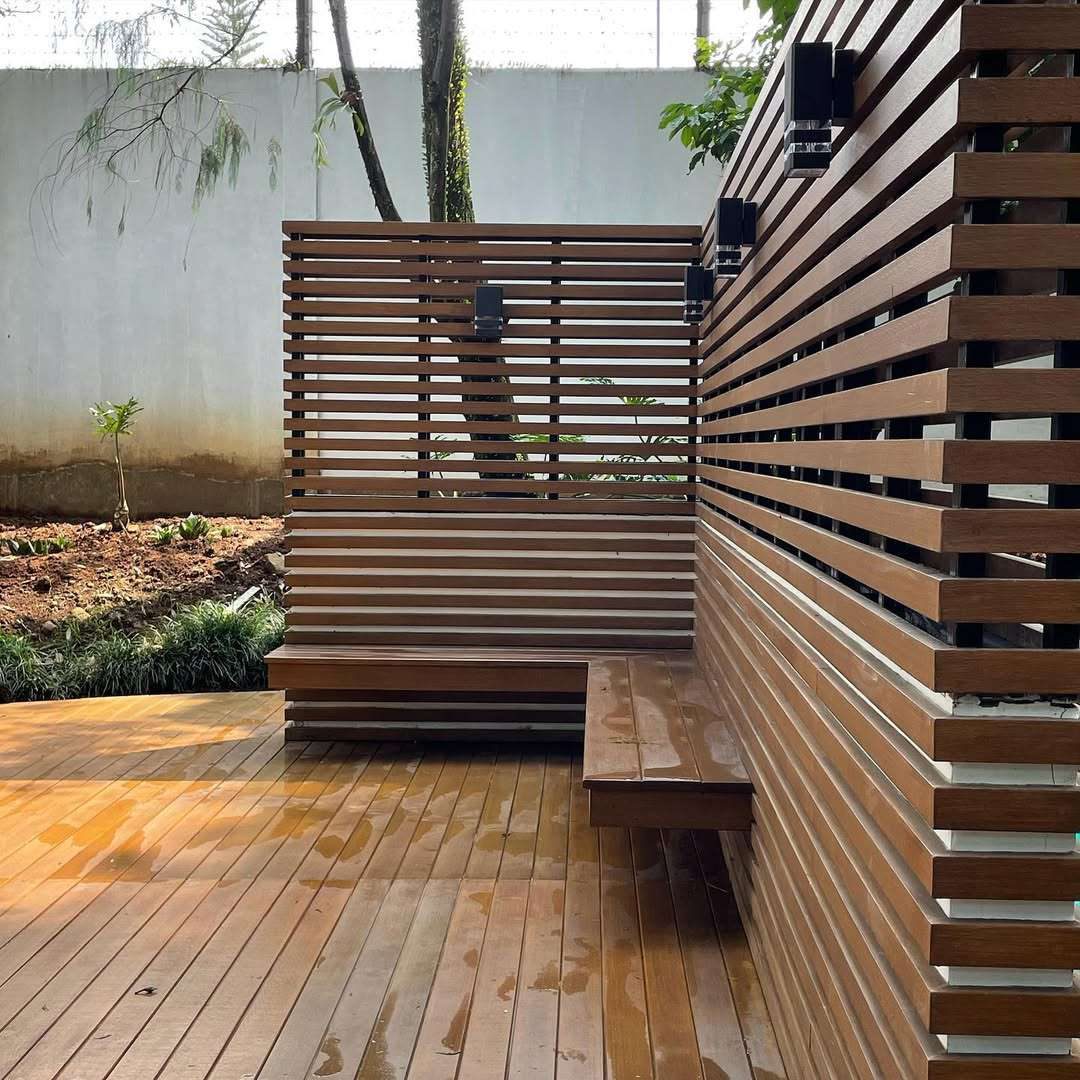 Woodium screen fence beside a deck